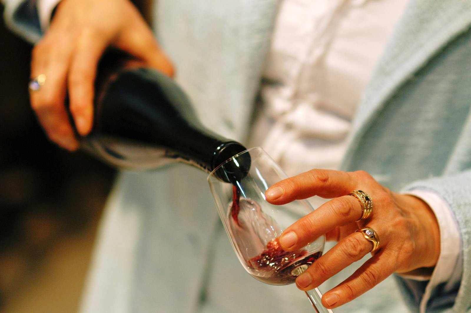 Red wine being poured into a wine glass